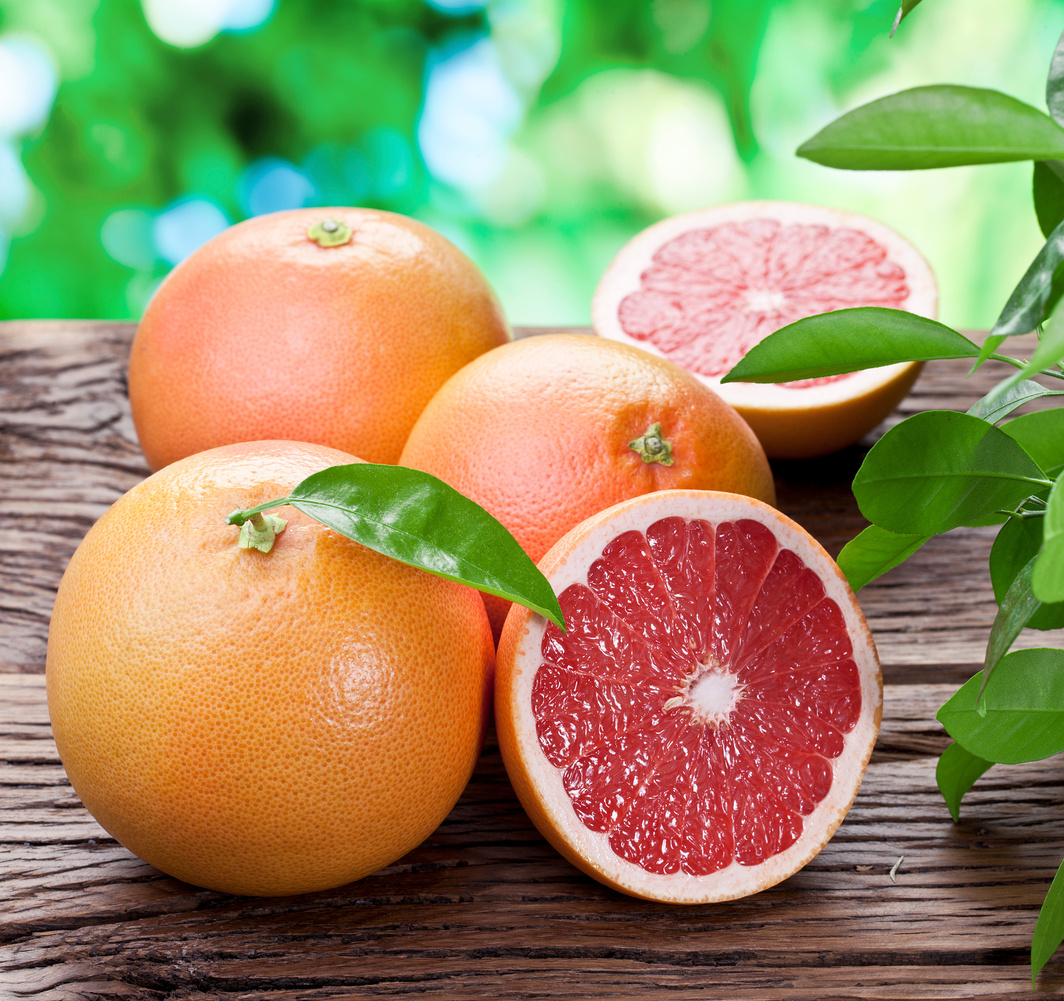 Grapefruits on a wooden table.